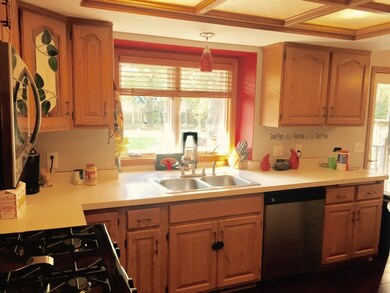The kitchen offers plenty of cabinet and counter s
