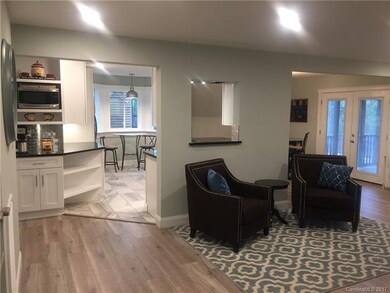 Lovely barnwood looking floors open into a redesig