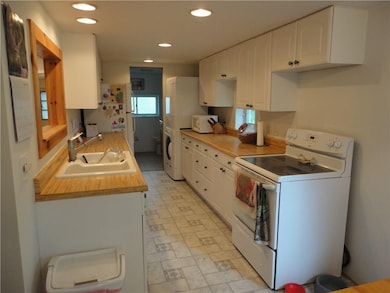 Kitchen / Door leading to Full Bathroom