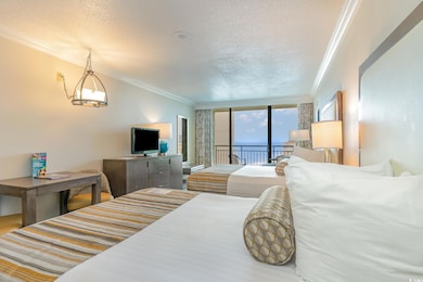 Bedroom with access to outside, a textured ceiling