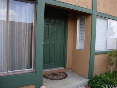 Front door on the west side of the house with livi