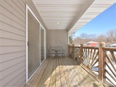 Enjoy warm days on this shaded front porch.