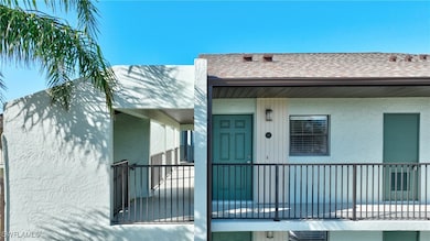 Property entrance with a balcony