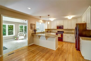 Renovated kitchen with granite counter tops and ha
