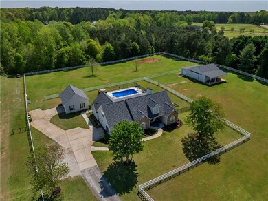 Drone / aerial view with a rural view and a view of trees