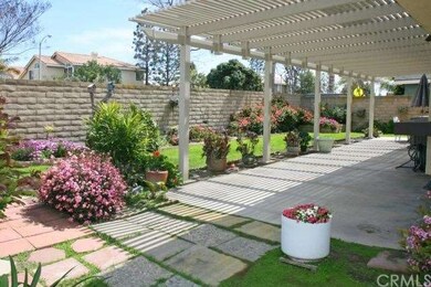 Covered Patio & Flowering Gardens
