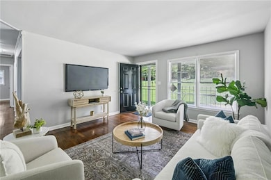 Light filled windows draw natural light into the living room.