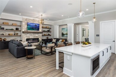 Kitchen with pendant lighting, a breakfast bar, wh