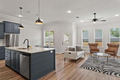 Kitchen with decorative pendant lighting over island
