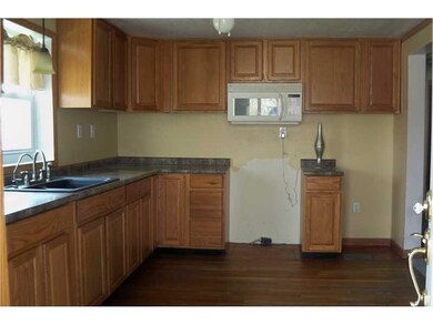Kitchen. The kitchen features oak cabinetry, rich-