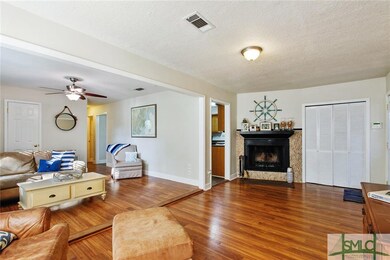 Large living area with woodburning fireplace.  Lou