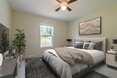 Large primary bedroom. Staged picture.