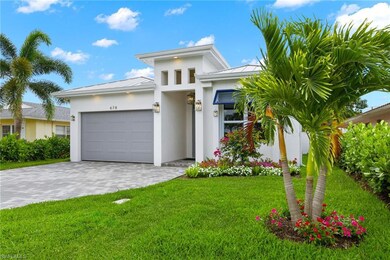 View of front of property featuring a garage and a