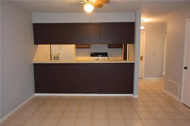 Dining room toward kitchen with breakfast bar