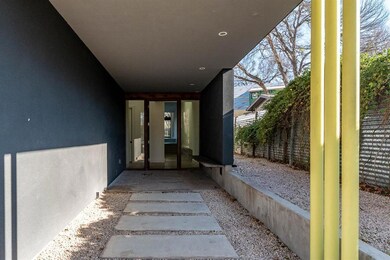 View of exterior entry featuring stucco siding an
