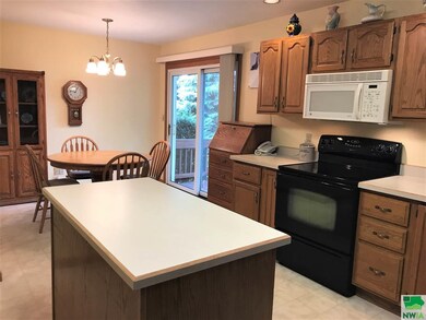 Oak cabinets throughout.  The island is movable. K