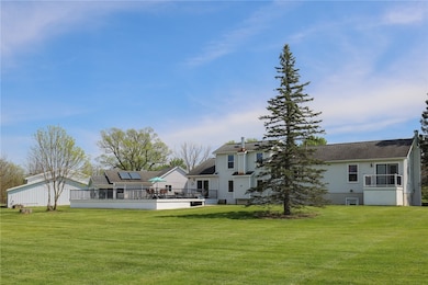 Rear view with above ground pool surrounded by ope
