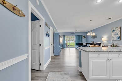 Kitchen with light hardwood / wood-style flooring,