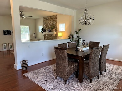 Dining area featuring a chandelier, wood finished