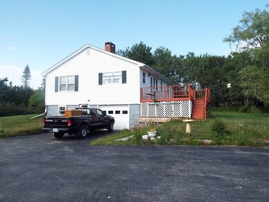 Exterior Side with Garage and Deck