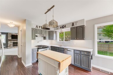 Grey Cabinets, Granite Counters, Octagon Tile Back