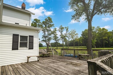 Deck with view of wooded area