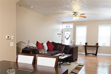 Wide open entry way into living and dining spaces.