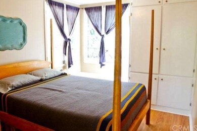 Sunny bedroom with ample storage.