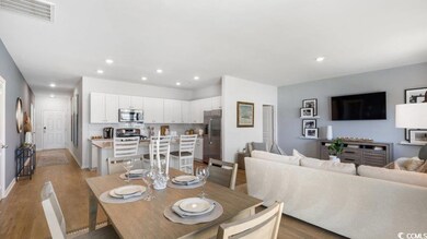 Dining space with recessed lighting, light wood-st