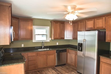 Stainless steel appliances and lovely vinyl floori