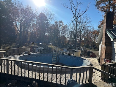 View of swimming pool featuring a deck and an empty pool