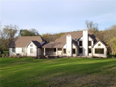 Rear view of home showing private covered porch an