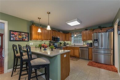 Large kitchen with stainless appliances and breakf