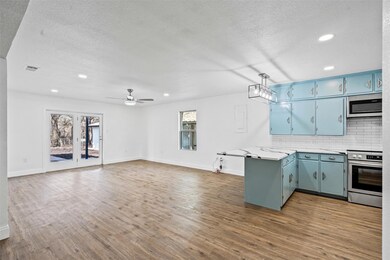 Kitchen with appliances with stainless steel finis