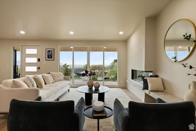 Living area featuring recessed lighting and a multi sided fireplace