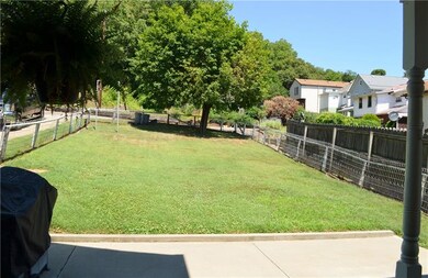 Nice covered cement patio and fenced yard