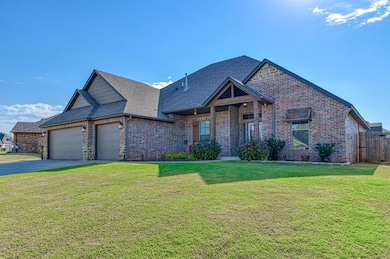 View of front of property featuring a shingled roof, an attached garage, brick siding, and driveway