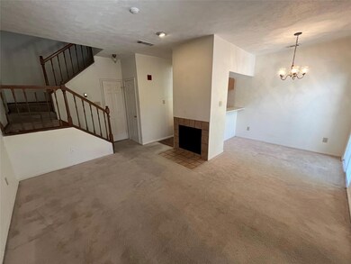 Living Room with a WBFP, Carpeted Floors, Open Sta