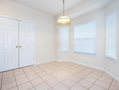 Breakfast area with tile floors and bay window