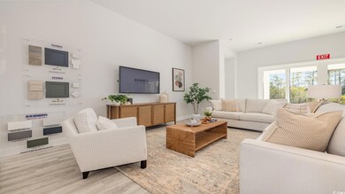 Living room featuring light hardwood / wood-style 