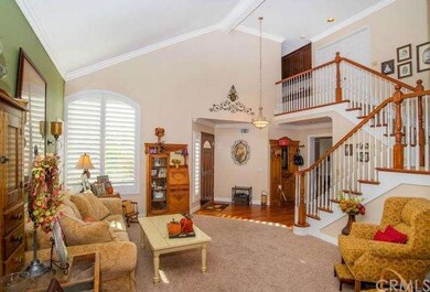 Two story entrance. View of the living room