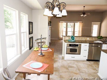 Upgraded appliances in eat-in open concept kitchen