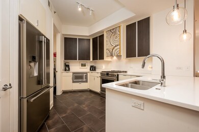 Kitchen with a sink, stainless steel appliances, d