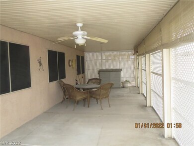 COVERED PATIO W/CEILING FAN & STORAGE POD
