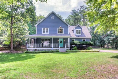 Wraparound porch with welcoming front door!