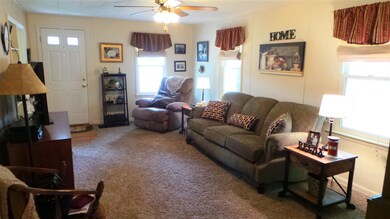 The spacious living room is bright and sunny