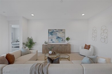 Living area featuring recessed lighting and basebo
