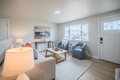 Living room featuring light wood finished floors and baseboards