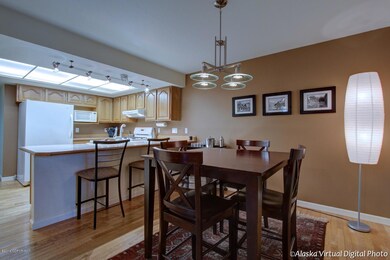 Dining & kitchen with hardwood floors