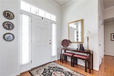 The foyer greets you with hardwood floors and an o